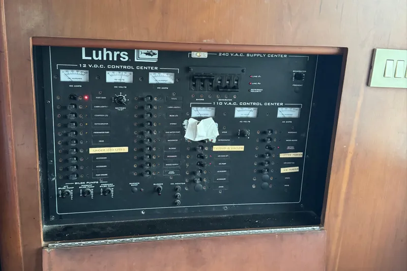 Slide: The Image of Electrical control panel on a 2004 Luhrs 36 Convertible boat. - 20