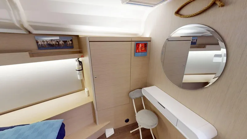 Slide: The Image of Interior of 2021 Beneteau Oceanis 40.1 yacht cabin with mirror and seating area. - 13