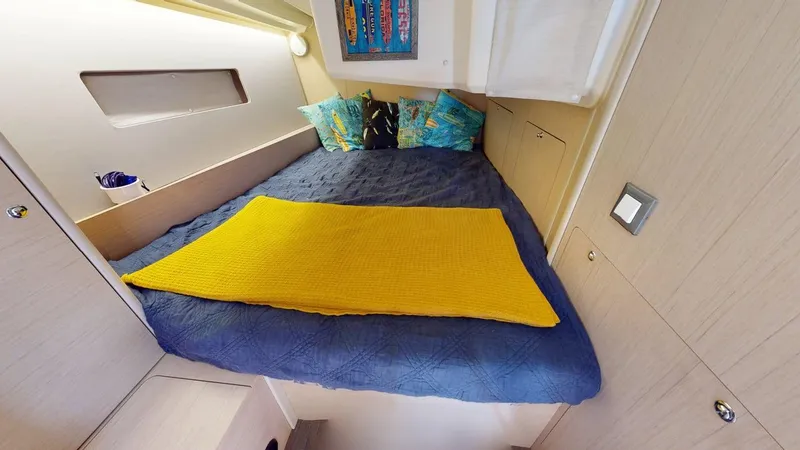 Slide: The Image of Cozy cabin interior of 2021 Beneteau Oceanis 40.1 with colorful bedding and modern decor. - 17