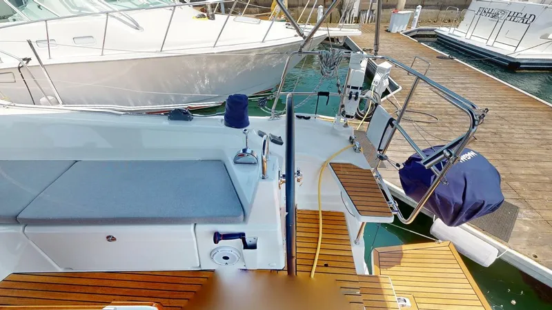 Slide: The Image of 2021 Beneteau Oceanis 40.1 yacht with teak deck and modern cockpit design at marina. - 23