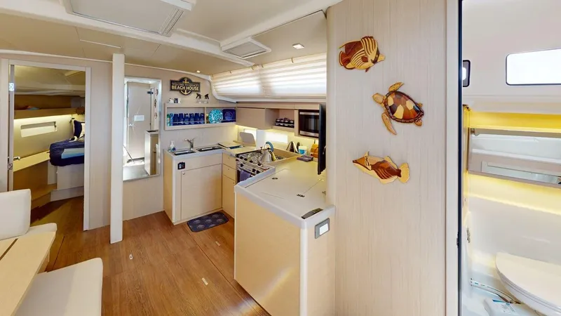 Slide: The Image of 2021 Beneteau Oceanis 40.1 yacht interior with modern kitchen and nautical decor. - 26