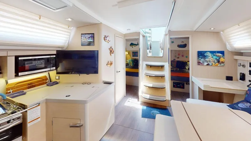 Slide: The Image of Interior of 2021 Beneteau Oceanis 40.1 yacht, featuring modern kitchen and cozy living area. - 27
