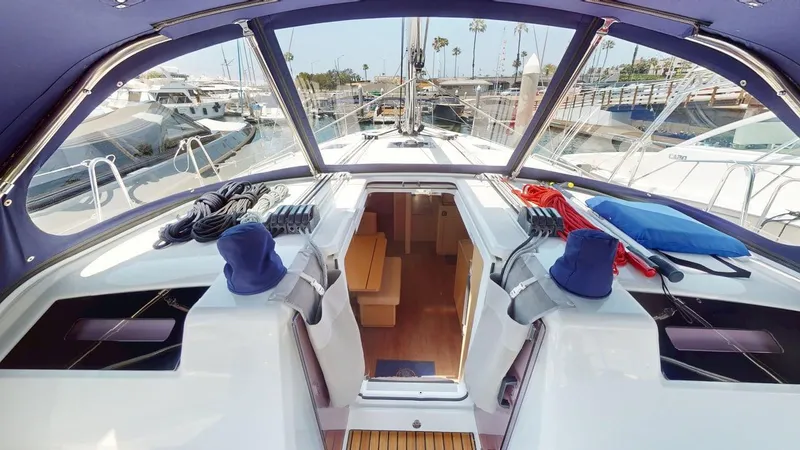 Slide: The Image of 2021 Beneteau Oceanis 40.1 yacht cockpit with open cabin, docked at marina. - 3