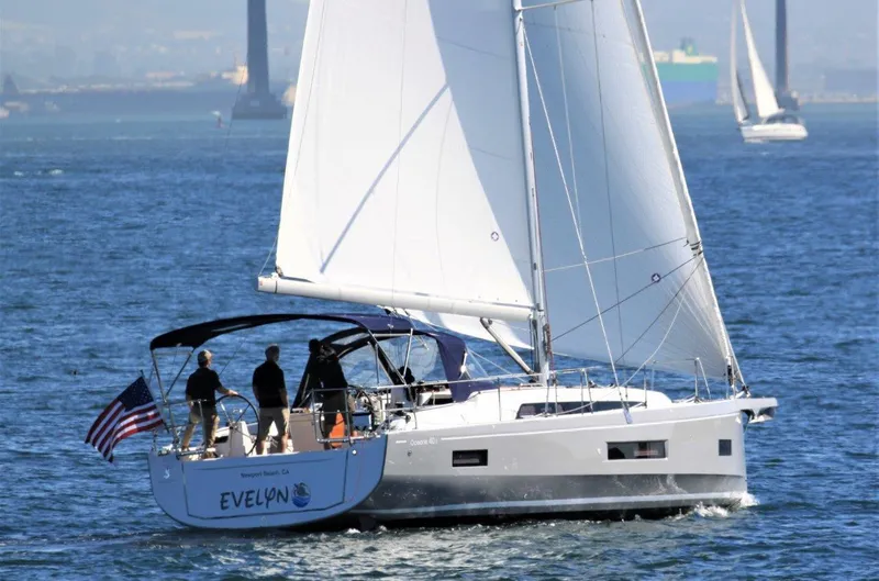 Slide: The Image of 2021 Beneteau Oceanis 40.1 sailing on open water with crew onboard. - 34