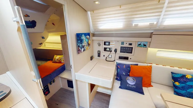 Slide: The Image of Interior of 2021 Beneteau Oceanis 40.1 yacht with cozy seating and navigation station. - 7