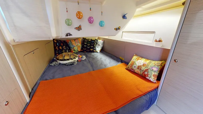 Slide: The Image of Cozy cabin interior of 2021 Beneteau Oceanis 40.1 with colorful bedding and decorations. - 9