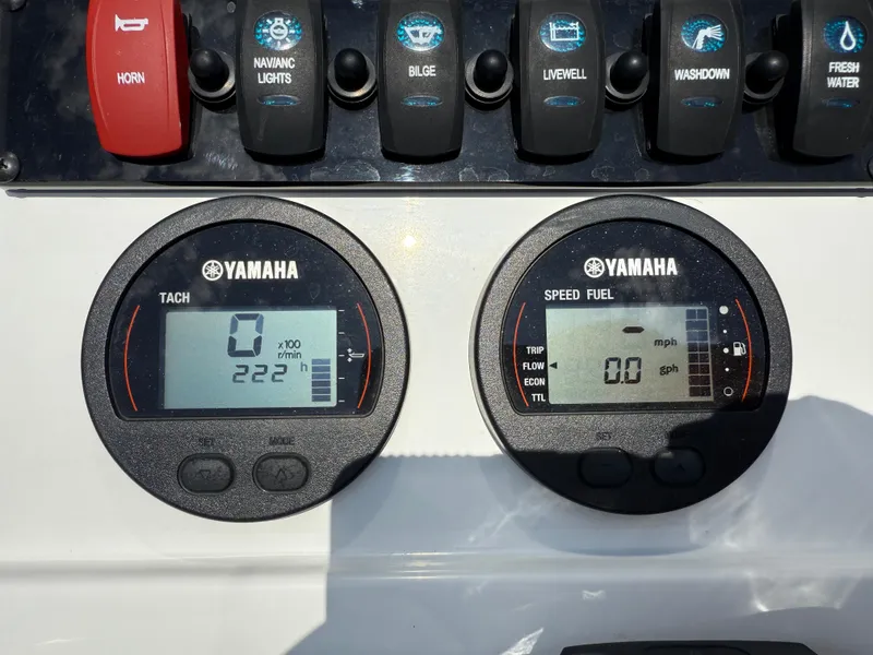 Slide: The Image of Dashboard of a 2021 Sea Hunt Ultra 219 boat with Yamaha gauges and controls. - 10