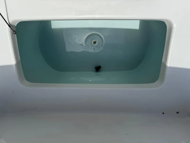 Slide: The Image of Livewell in 2021 Sea Hunt Ultra 219 boat, filled with water. - 18