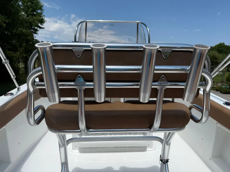 Slide: The Image of 2021 Sea Hunt Ultra 219 boat with rod holders and cushioned seating. - 19