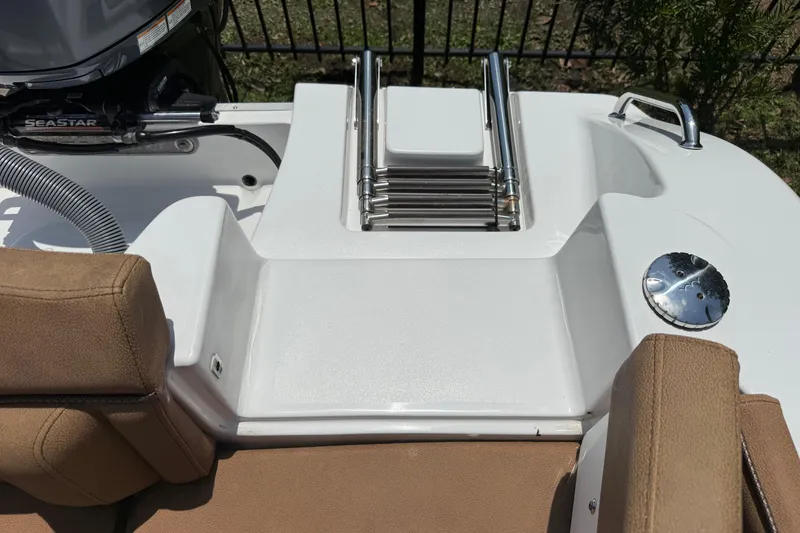 Slide: The Image of 2021 Sea Hunt Ultra 219 boat with swim platform and ladder. - 23