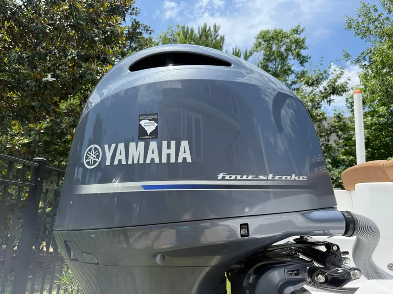 Slide: The Image of Yamaha four-stroke outboard motor on a 2021 Sea Hunt Ultra 219 boat. - 6