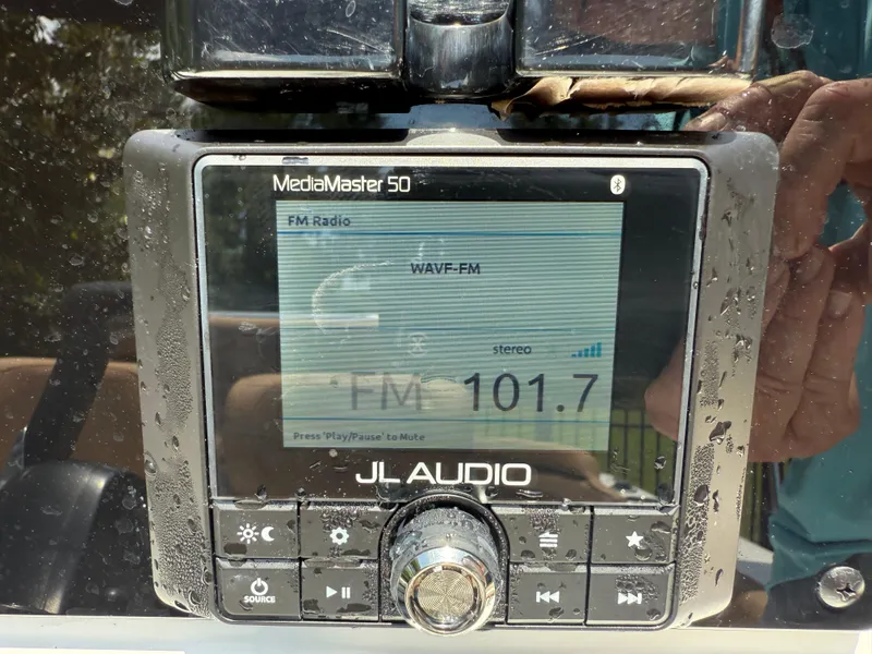 Slide: The Image of JL Audio MediaMaster 50 displaying FM radio station 101.7 on a Sea Hunt Ultra 219 boat. - 9