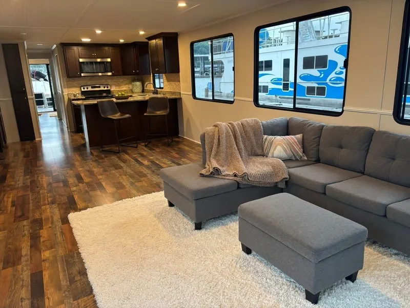 Slide: The Image of Modern interior of 1992 Lakeview houseboat with cozy seating and kitchen area. - 2
