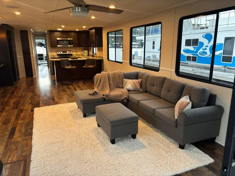 Slide: The Image of Luxurious 1992 Lakeview houseboat interior with modern kitchen, cozy living area, and stylish decor. - 3