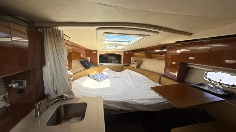 Slide: The Image of Interior of 2010 Sea Ray 310 Sundancer yacht with cozy cabin and skylight. - 5