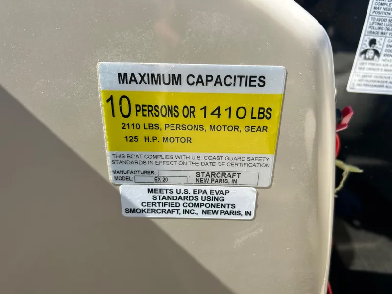 Slide: The Image of 2019 Starcraft EX 20 C capacity label, 10 persons or 1410 lbs, 125 HP motor. - 10