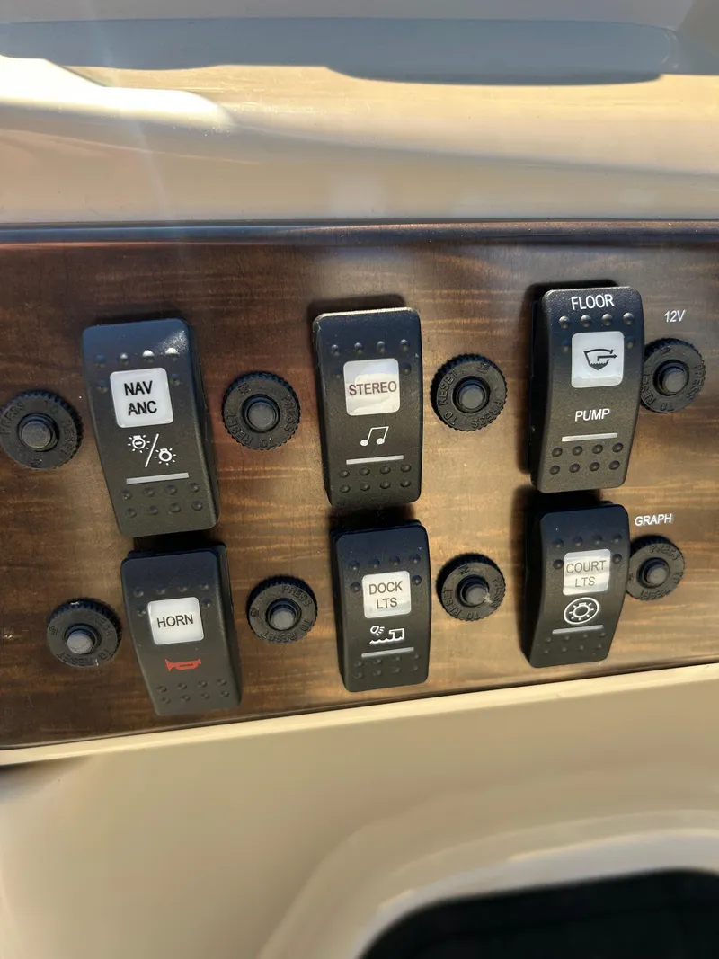 Slide: The Image of Control panel of a 2019 Starcraft EX 20 C boat with labeled switches. - 9