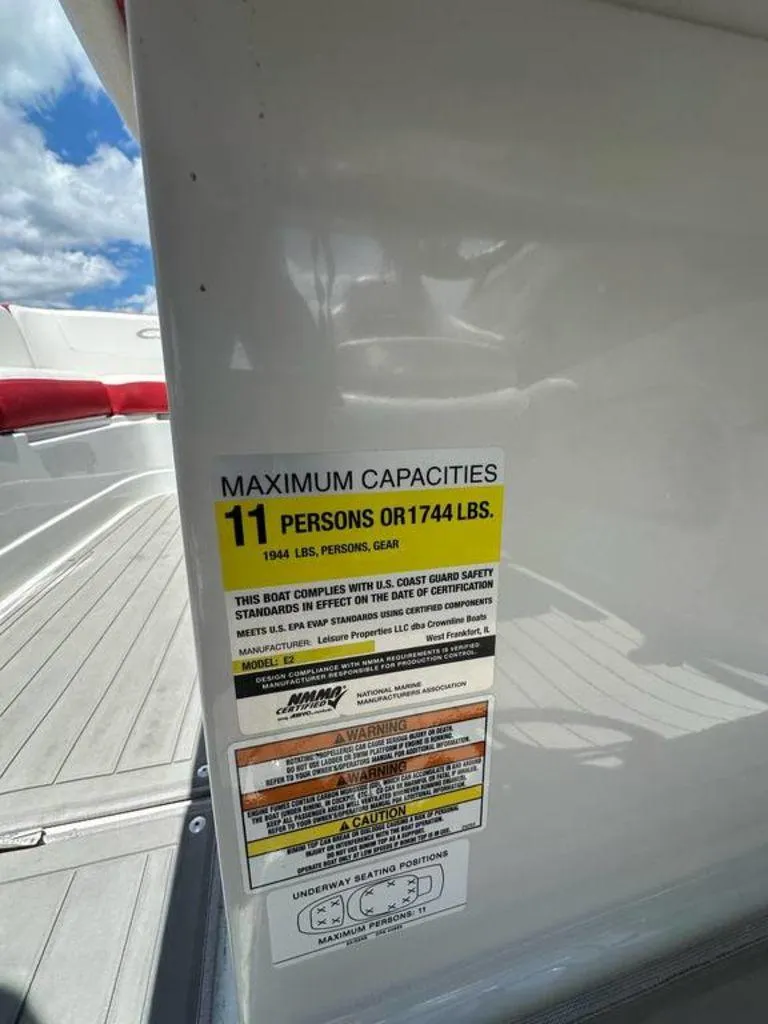 Slide: The Image of 2017 Crownline E2 boat capacity label, maximum 11 persons or 1744 lbs. - 10