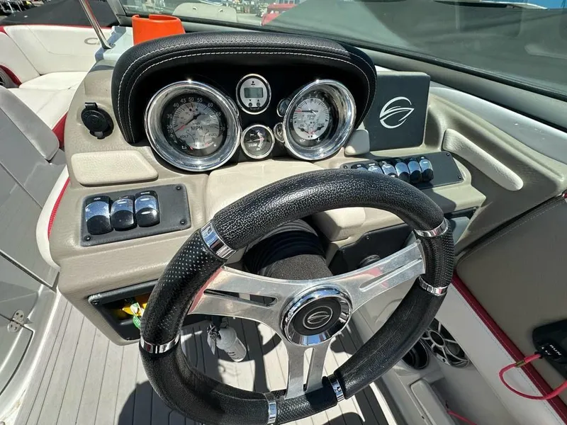 Slide: The Image of 2017 Crownline E2 boat dashboard with steering wheel and gauges. - 9