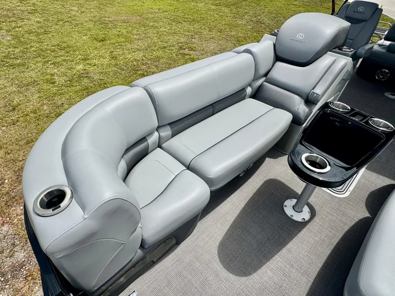 Slide: The Image of Luxurious seating on 2022 Regency 230 LE3 Sport boat with cup holders and sleek design. - 11