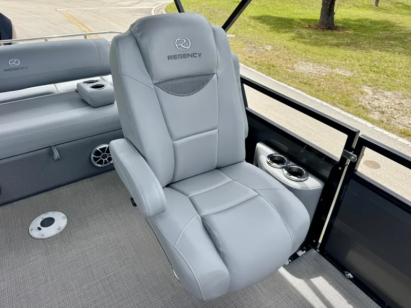 Slide: The Image of Luxurious gray seating in 2022 Regency 230 LE3 Sport boat with cup holders. - 14