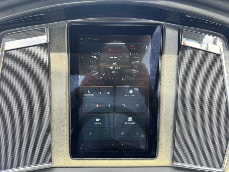 Slide: The Image of Touchscreen control panel of 2022 Regency 230 LE3 Sport boat dashboard. - 17