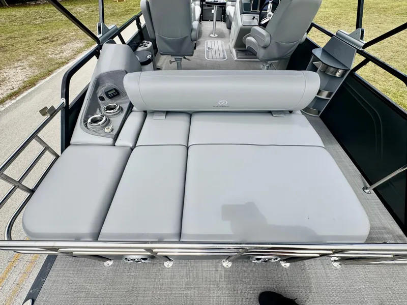 Slide: The Image of 2022 Regency 230 LE3 Sport boat with gray seating and cup holders. - 22