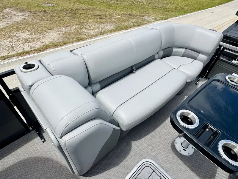 Slide: The Image of Luxurious seating on 2022 Regency 230 LE3 Sport pontoon boat with cup holders. - 8