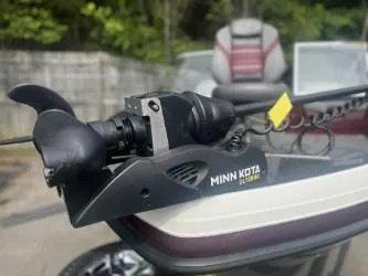 Slide: The Image of 2023 Ranger 1880MS boat with Minn Kota trolling motor, outdoor setting. - 2