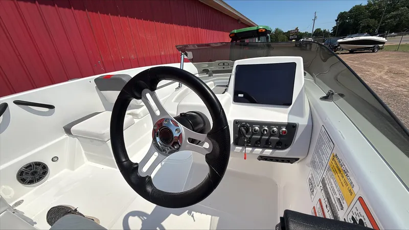 Slide: The Image of 2025 Tahoe T18 boat cockpit with steering wheel and control panel. - 3