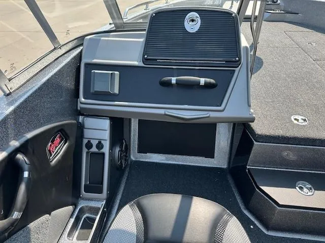 Slide: The Image of Interior of 2025 Ranger 1880MS boat, featuring dashboard and seating area. - 10