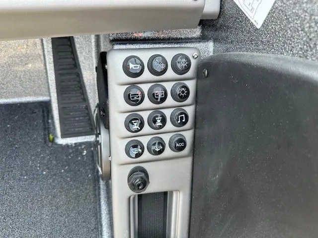 Slide: The Image of Control panel of 2025 Ranger 1880MS boat with various function buttons. - 12