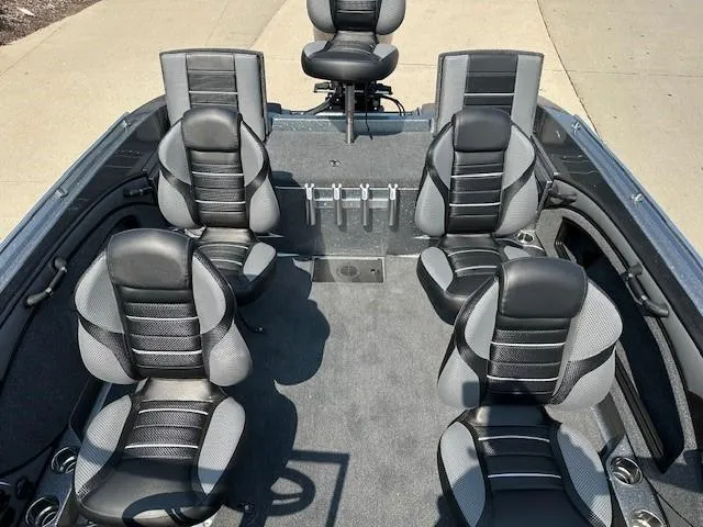Slide: The Image of 2025 Ranger 1880MS boat interior with six black and gray seats. - 13