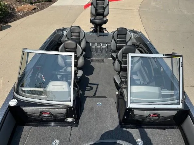 Slide: The Image of 2025 Ranger 1880MS boat interior with seating and open windshields. - 8