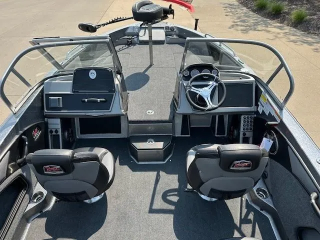 Slide: The Image of 2025 Ranger 1880MS boat interior with dual seats, steering wheel, and control panel. - 9