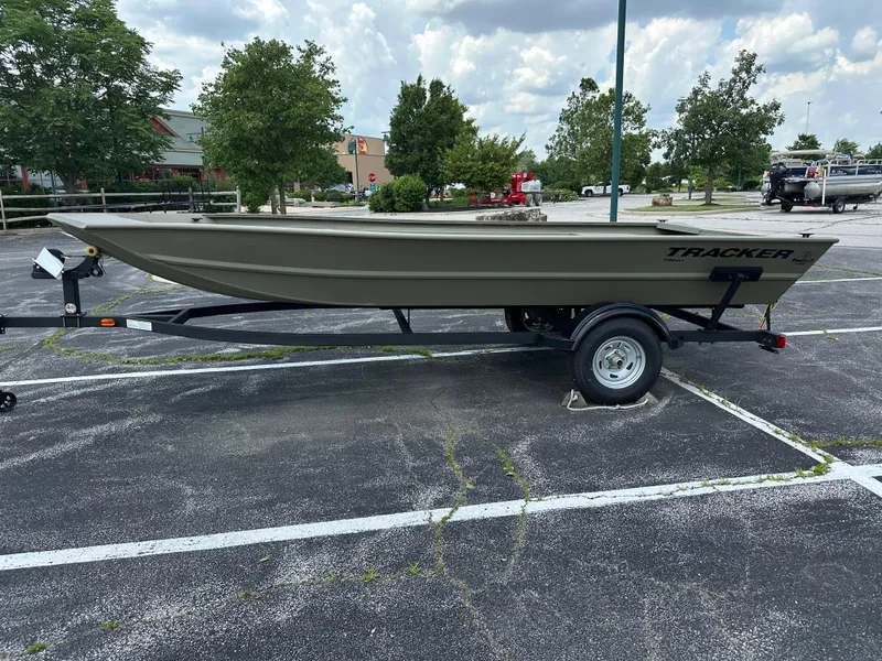 The Image of 2025 Tracker Grizzly 1754 Jon boat on trailer in parking lot. - 0