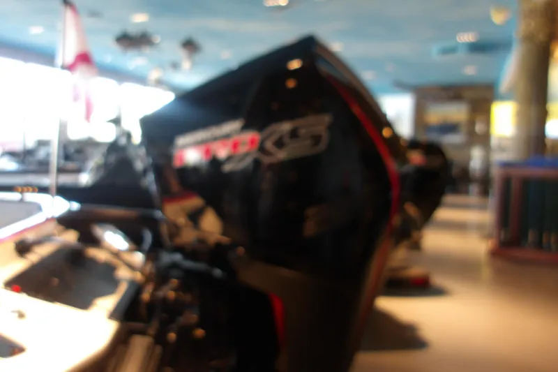 Slide: The Image of Blurry image of a 2025 Ranger Z519R Cup-Equipped boat in a showroom setting. - 107