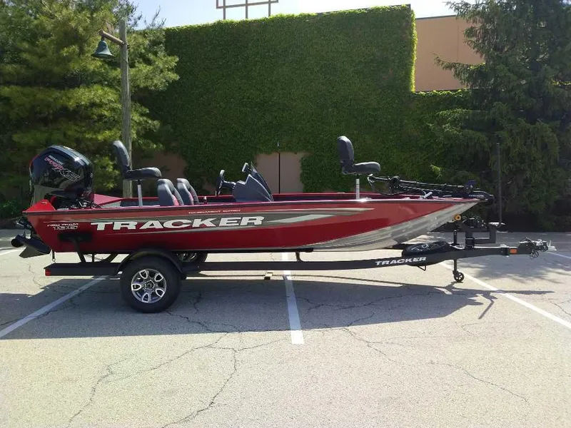 The Image of 2025 Tracker Pro Team 195 Tournament Edition boat in a parking lot. - 0