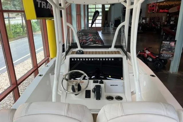 Slide: The Image of 2025 Ranger 2510 Bay boat interior with modern dashboard and steering wheel. - 8