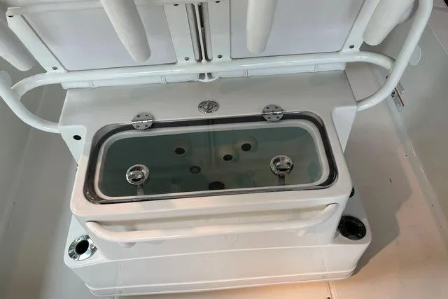 Slide: The Image of 2025 Ranger 2510 Bay boat livewell with seating and cup holders. - 4