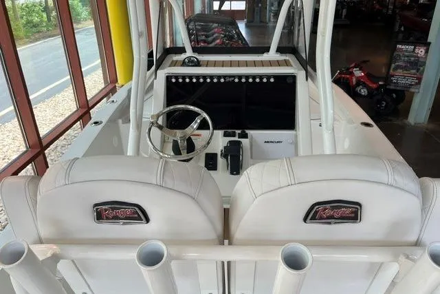 Slide: The Image of 2025 Ranger 2510 Bay boat interior with dual seats and modern dashboard. - 7