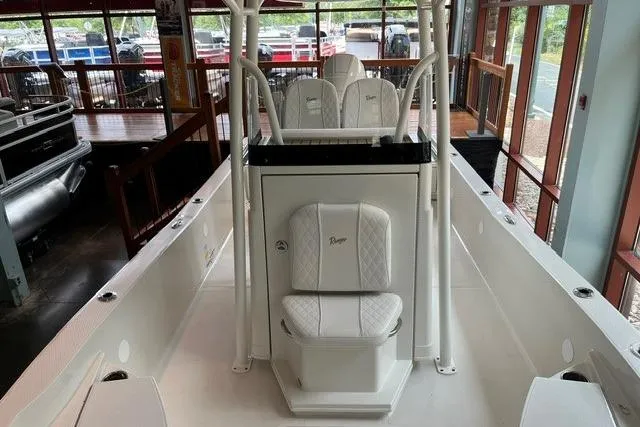 Slide: The Image of 2025 Ranger 2510 Bay boat interior with white seating and modern design. - 11