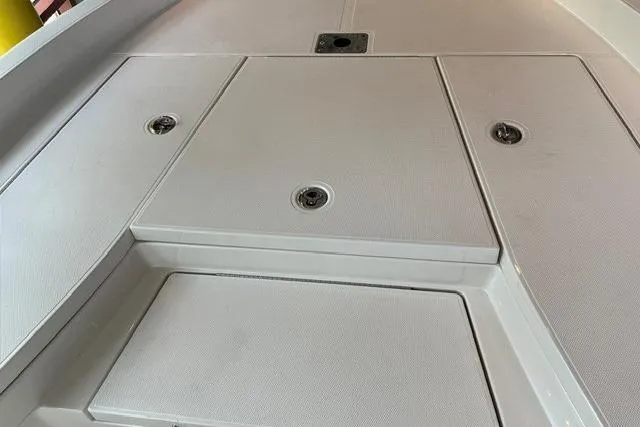 Slide: The Image of 2025 Ranger 2510 Bay boat deck with storage compartments. - 9