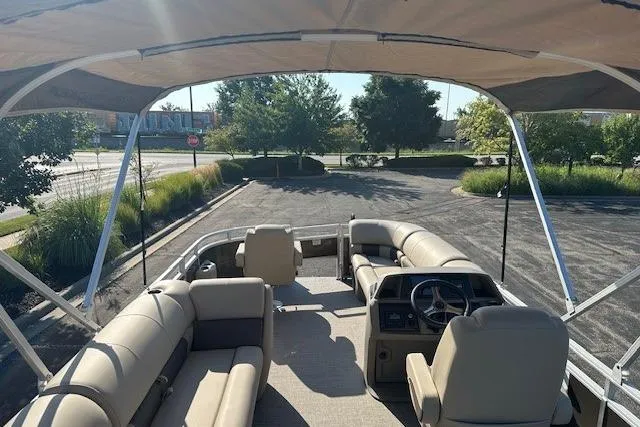 Slide: The Image of 2025 Sun Tracker SportFish 20 DLX pontoon boat with spacious seating and canopy. - 3