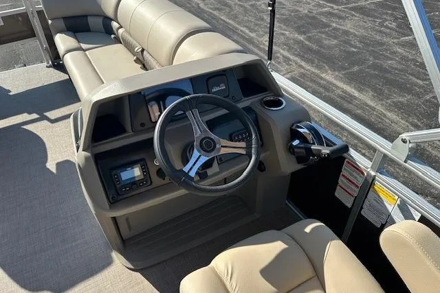 Slide: The Image of 2025 Sun Tracker SportFish 20 DLX boat interior with steering wheel and seating. - 8
