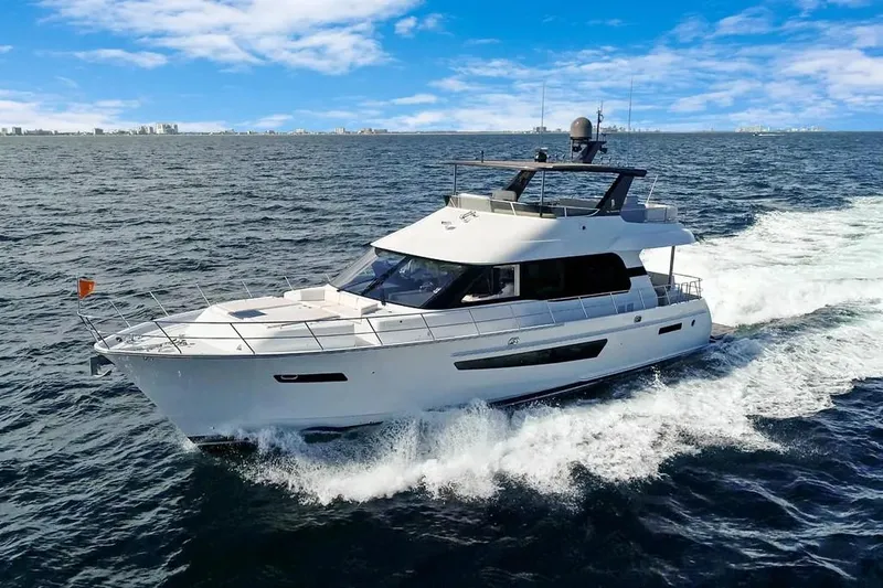 The Image of 2023 CL Yachts CLB65 cruising on open water under a clear blue sky. - 0