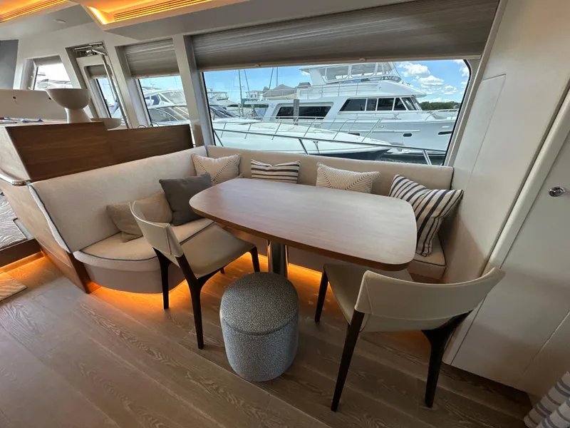 Slide: The Image of Luxurious 2023 CL Yachts CLB65 interior with elegant dining area and marina view. - 29