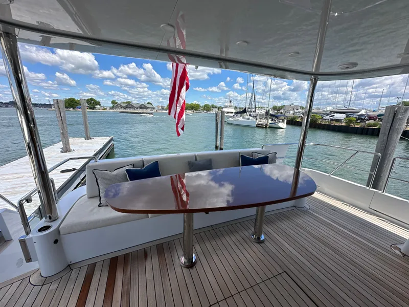 Slide: The Image of 2023 CL Yachts CLB65 yacht deck with elegant seating and waterfront view. - 3