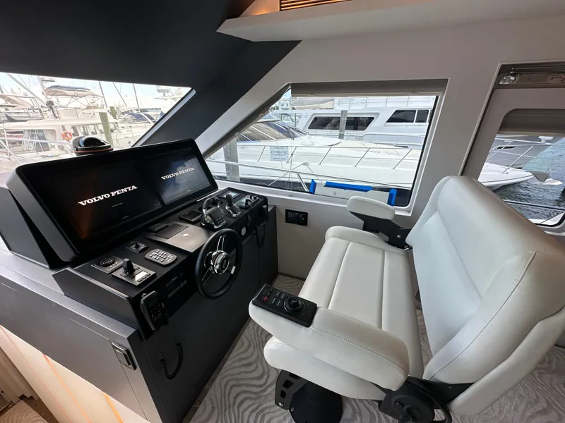 Slide: The Image of Helm station of 2023 CL Yachts CLB65 with modern controls and comfortable seating. - 32