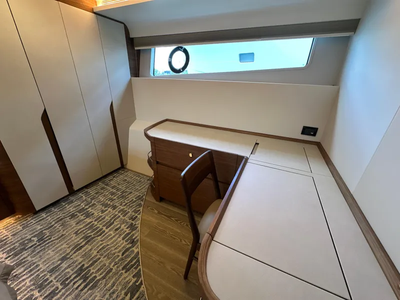 Slide: The Image of Luxurious interior of 2023 CL Yachts CLB65 with elegant desk and window view. - 36